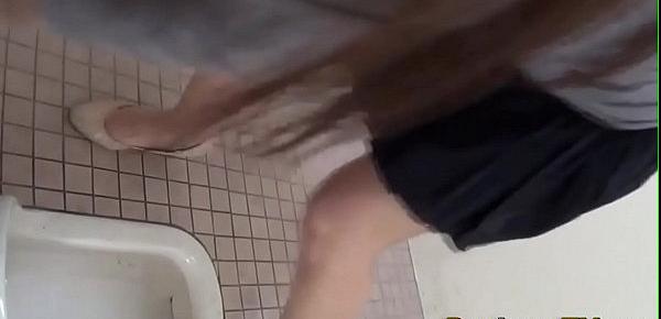  Asians squat and urinate into toliet